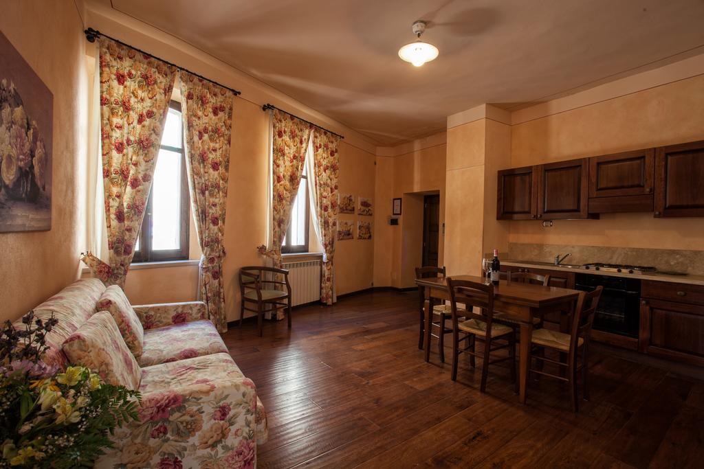 Апарт отель Residenza Palazzo Saloni Монтальчино Экстерьер фото