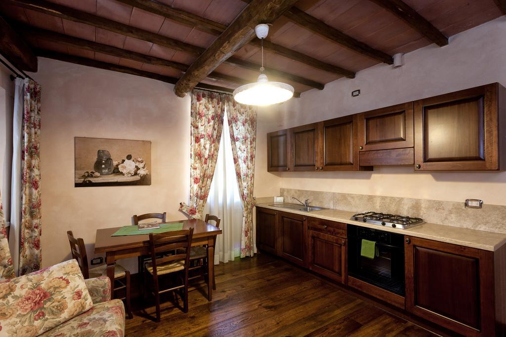 Апарт отель Residenza Palazzo Saloni Монтальчино Экстерьер фото