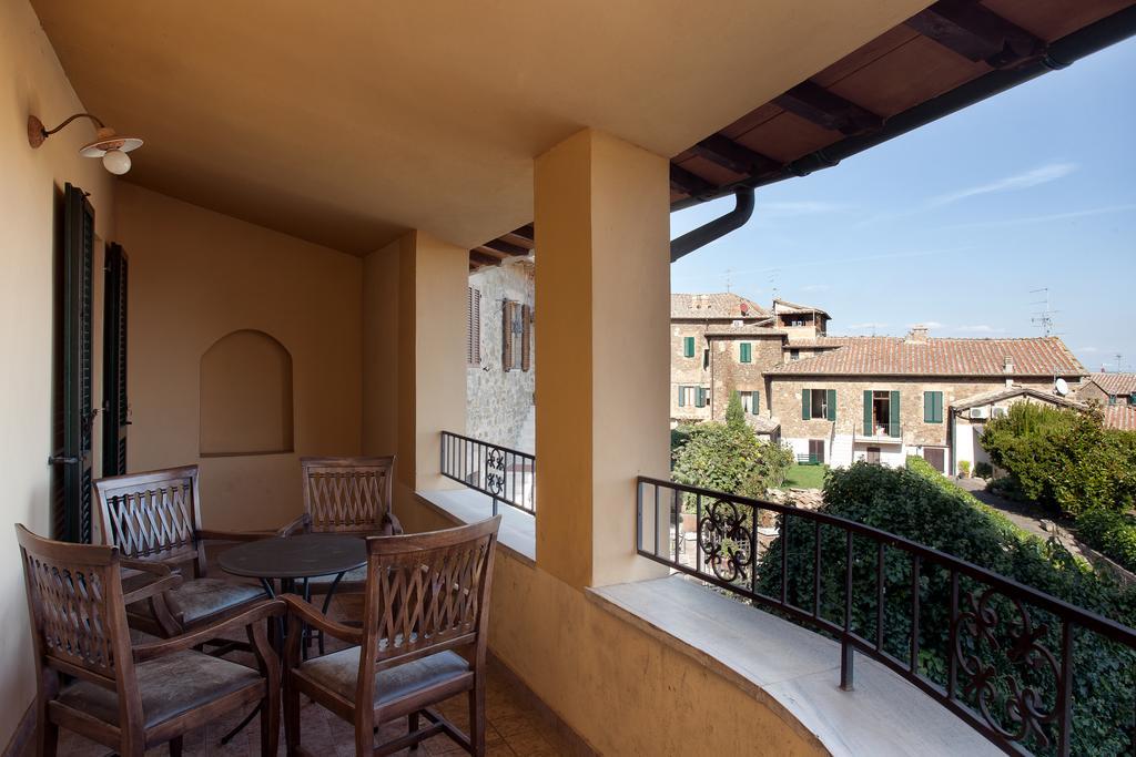 Апарт отель Residenza Palazzo Saloni Монтальчино Экстерьер фото