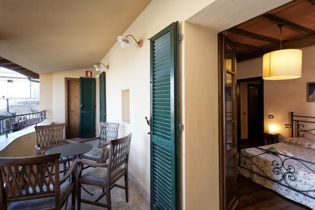 Апарт отель Residenza Palazzo Saloni Монтальчино Экстерьер фото