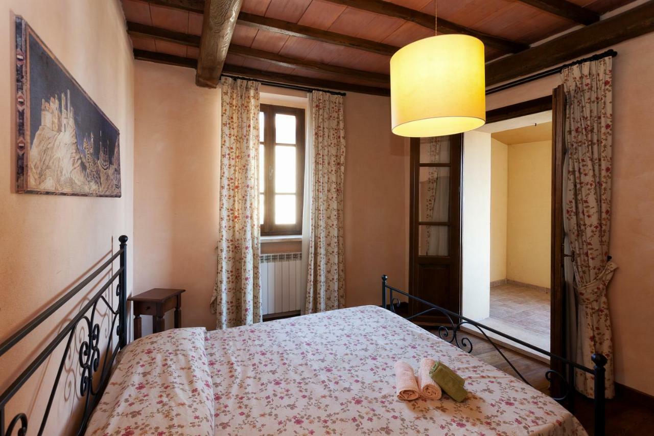 Апарт отель Residenza Palazzo Saloni Монтальчино Экстерьер фото
